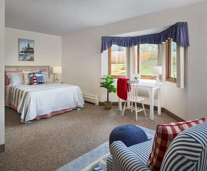 Apartment bedroom at American House Kentwood Elder Home